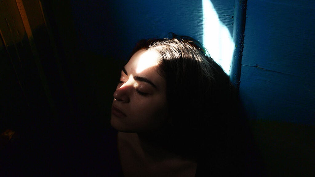 Confident Girl Training Boxe In A Open Public Gym, Dramatic Light