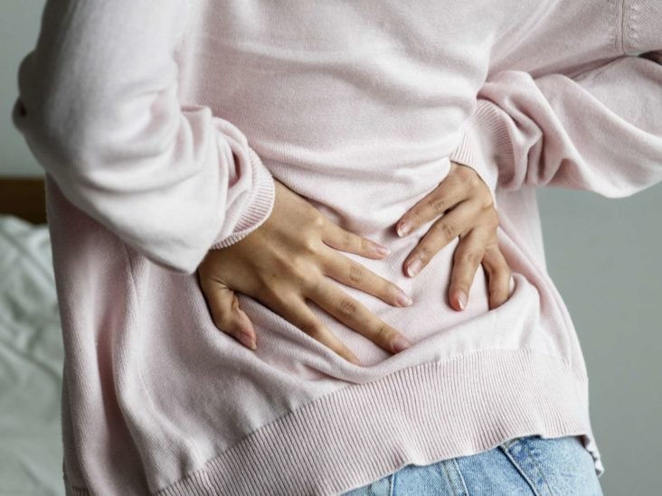 Back pain and nausea: Possible causes and treatments