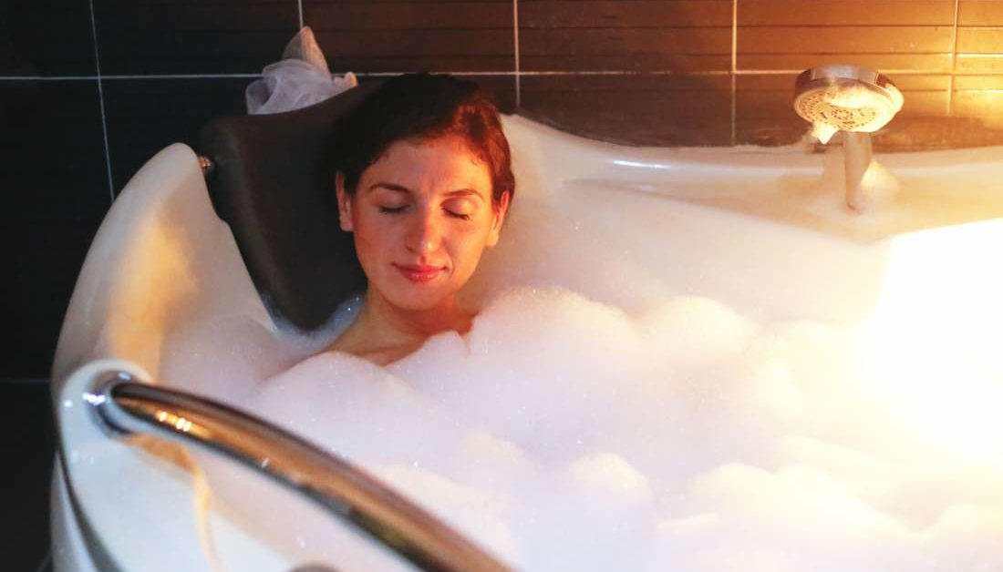 When's the best time to take a warm bath for better sleep?