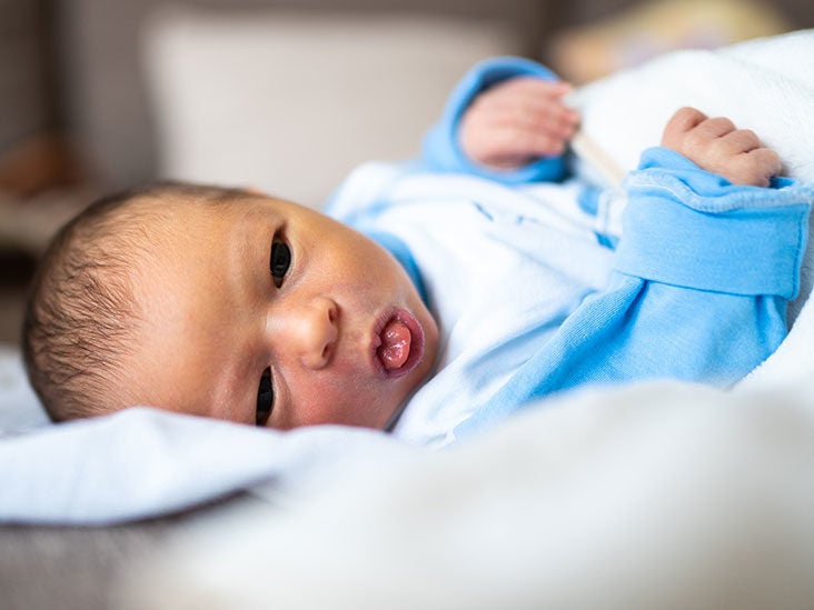 baby pushing bottle out with tongue