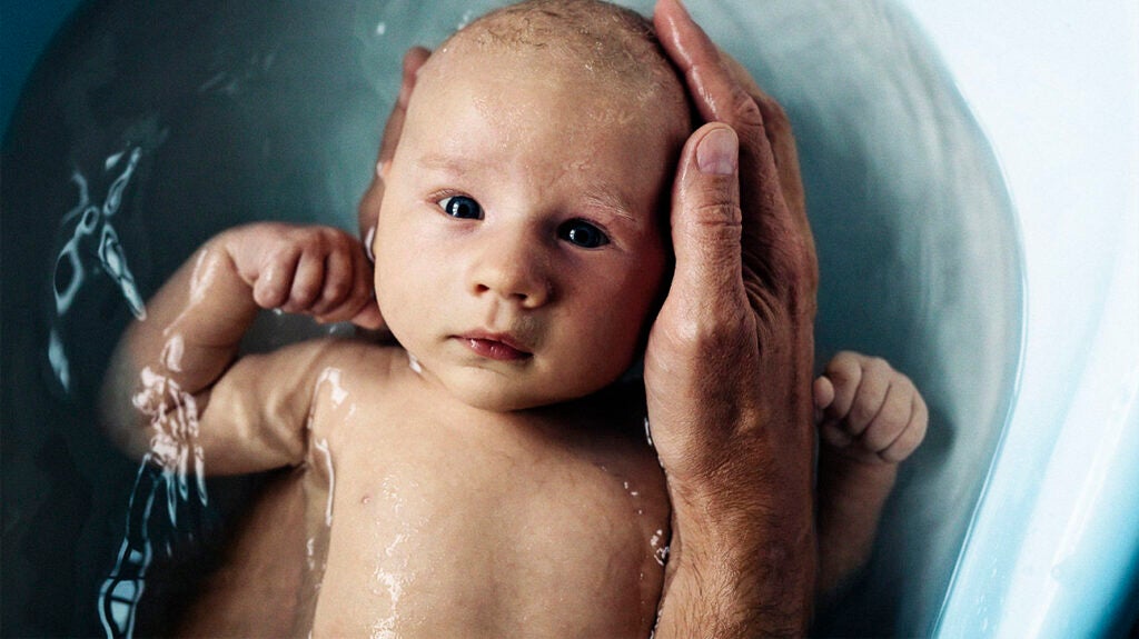 Baby grabbing head and hot sale crying