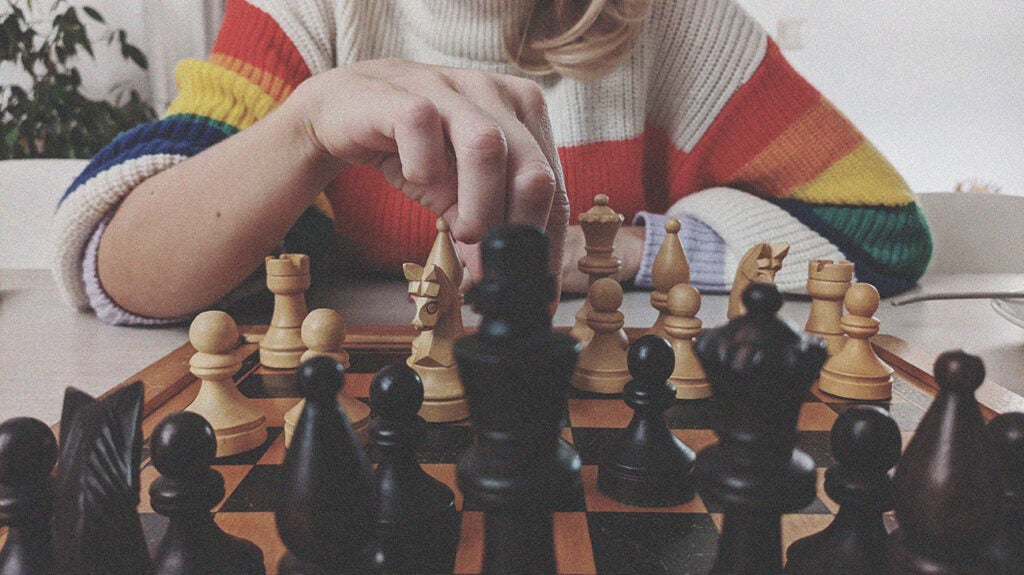 Male chess player with figures in the eyes, thinking process