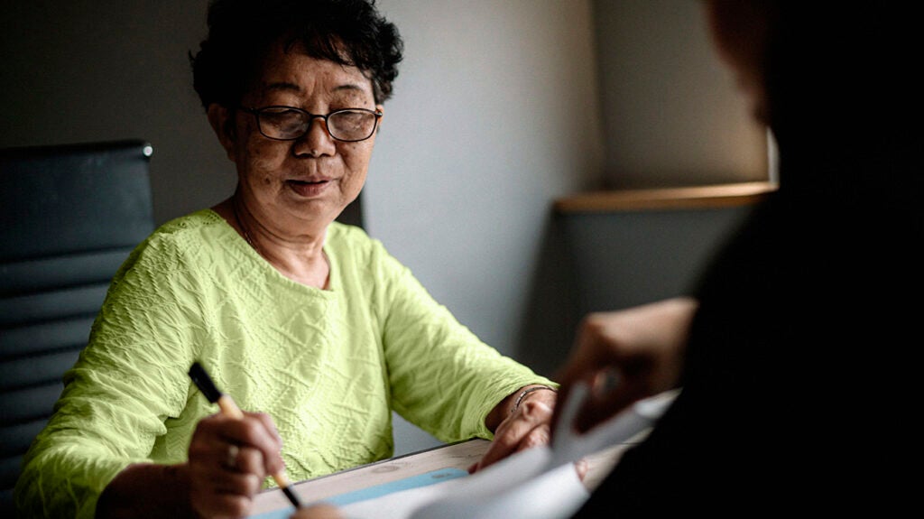 A woman doing an MoCA test for dementia.