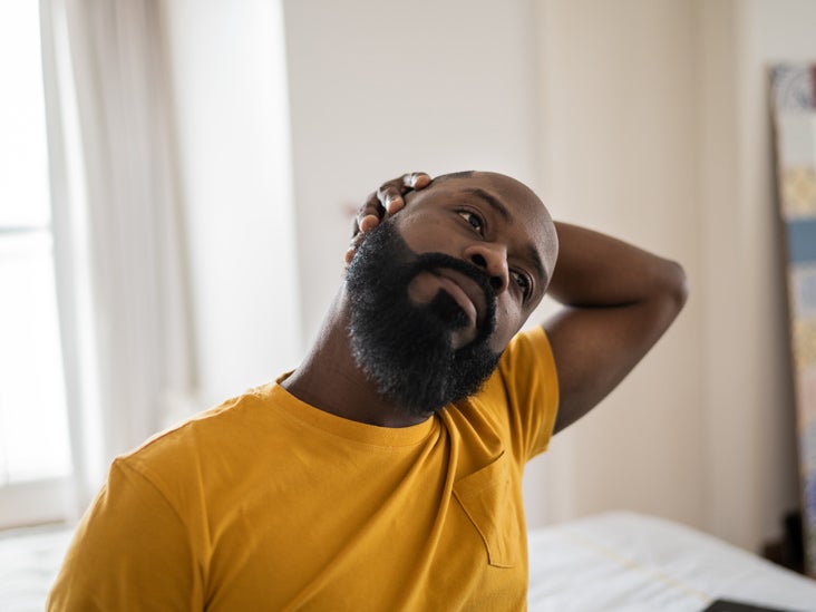 https://post.medicalnewstoday.com/wp-content/uploads/sites/3/2023/04/man_stretching_neck_at_home_732x549-thumbnail.jpg